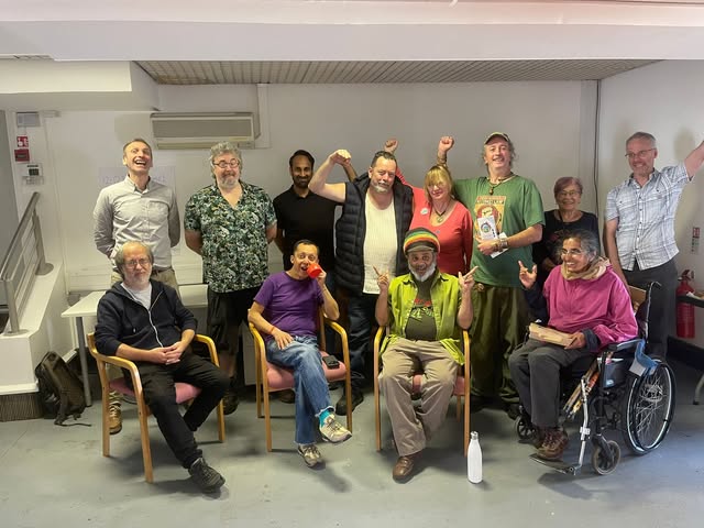 Community meeting in a London hall